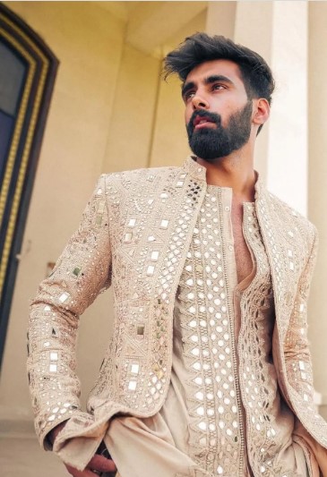 Kshkin elegant groom’s sherwani with golden fabric and dazzling mirror work for grand celebrations