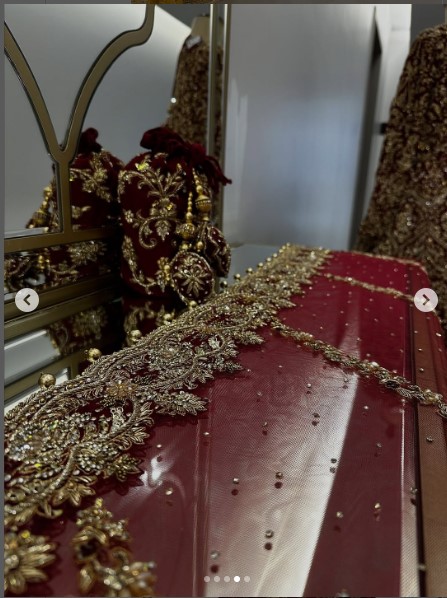 Long trail bridal outfit with gold and maroon detailing